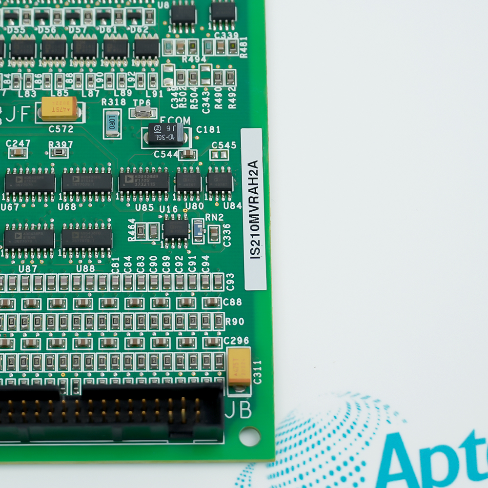 Close-up of the board silkscreen reading IS210MVRAH2A beside surface-mount ICs and a ribbon connector