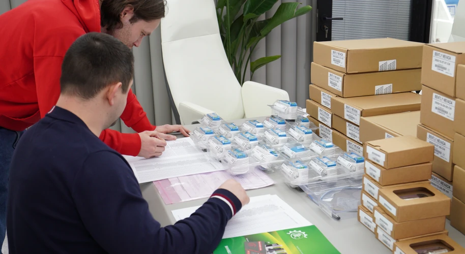 Reviewing packaged industrial parts alongside order documents