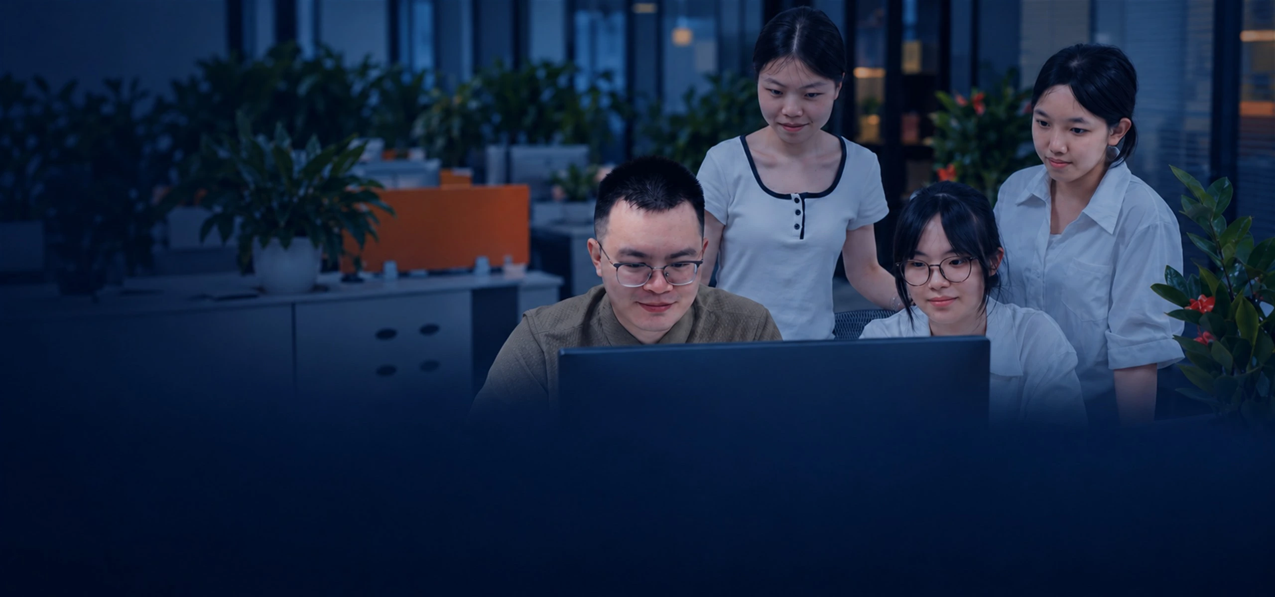 Apter Power team coordinating customer enquiries at a shared workstation